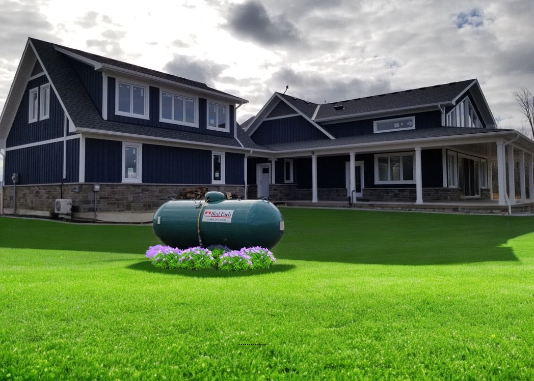 Residential propane tank with Bird Fuels branding on a manicured lawn